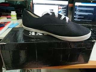 Define Black sneakers