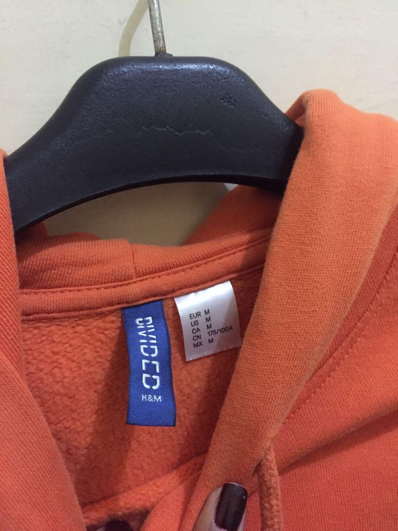 Hoodie orange broke Fesyen Pria Pakaian Atasan di Carousell