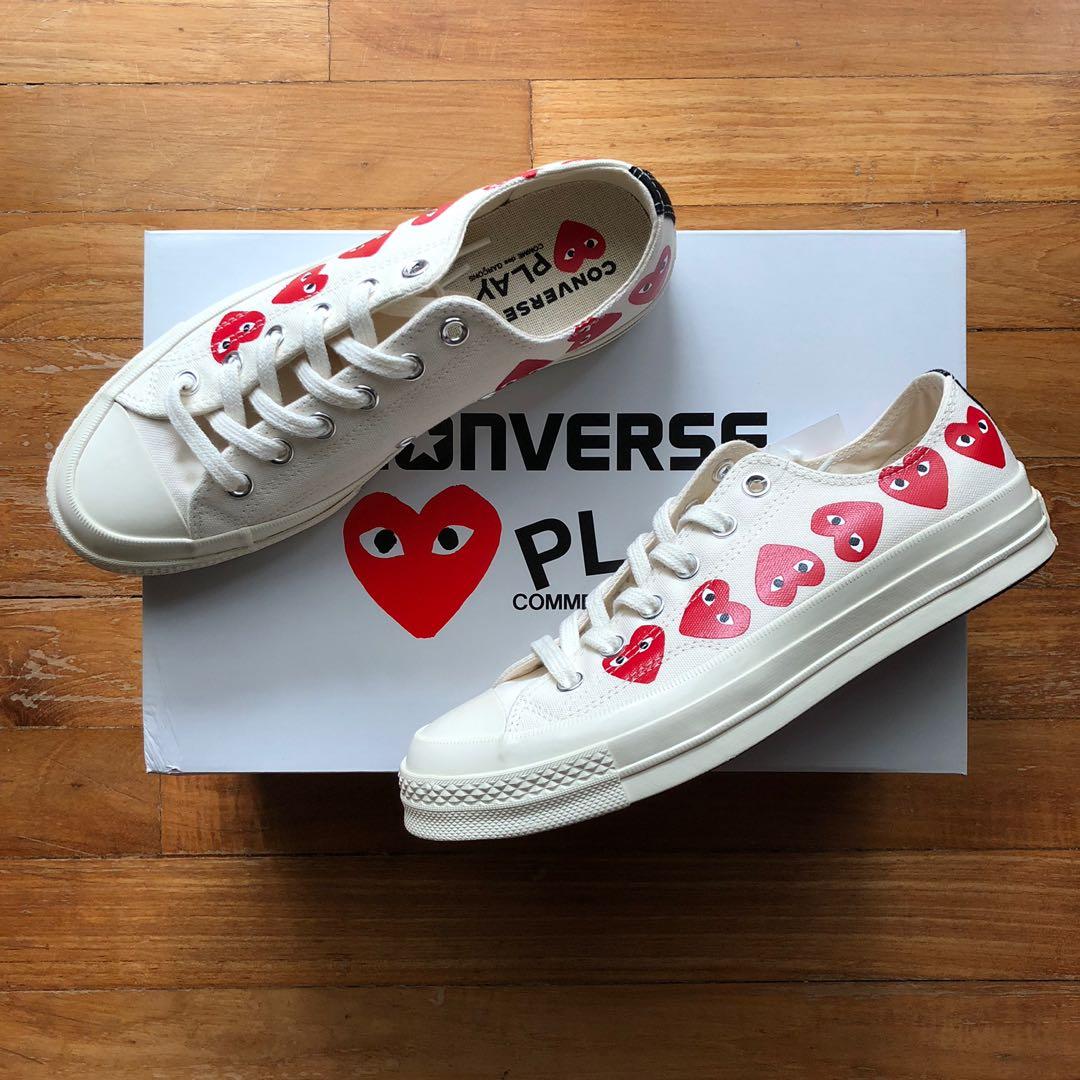 cdg converse low white on feet