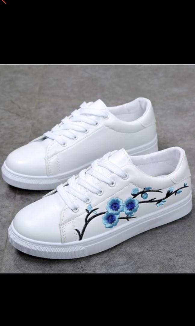 white shoes with embroidered flowers