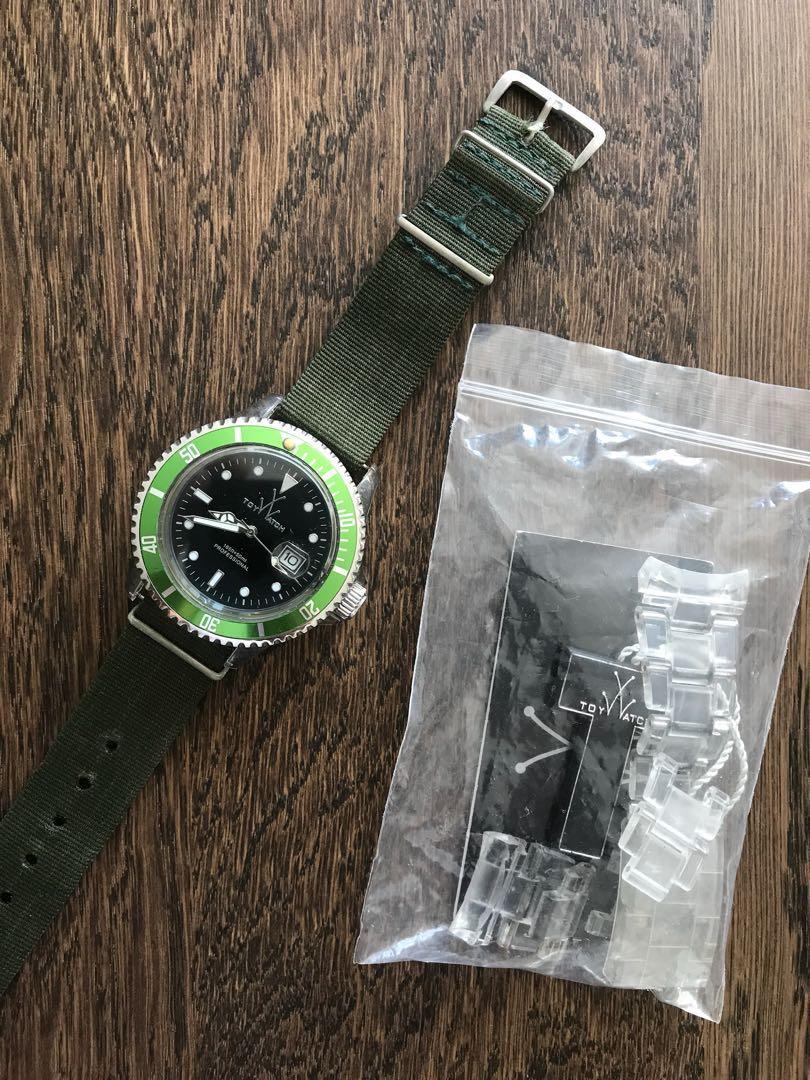 Toy watch with green bezel insert Carousell
