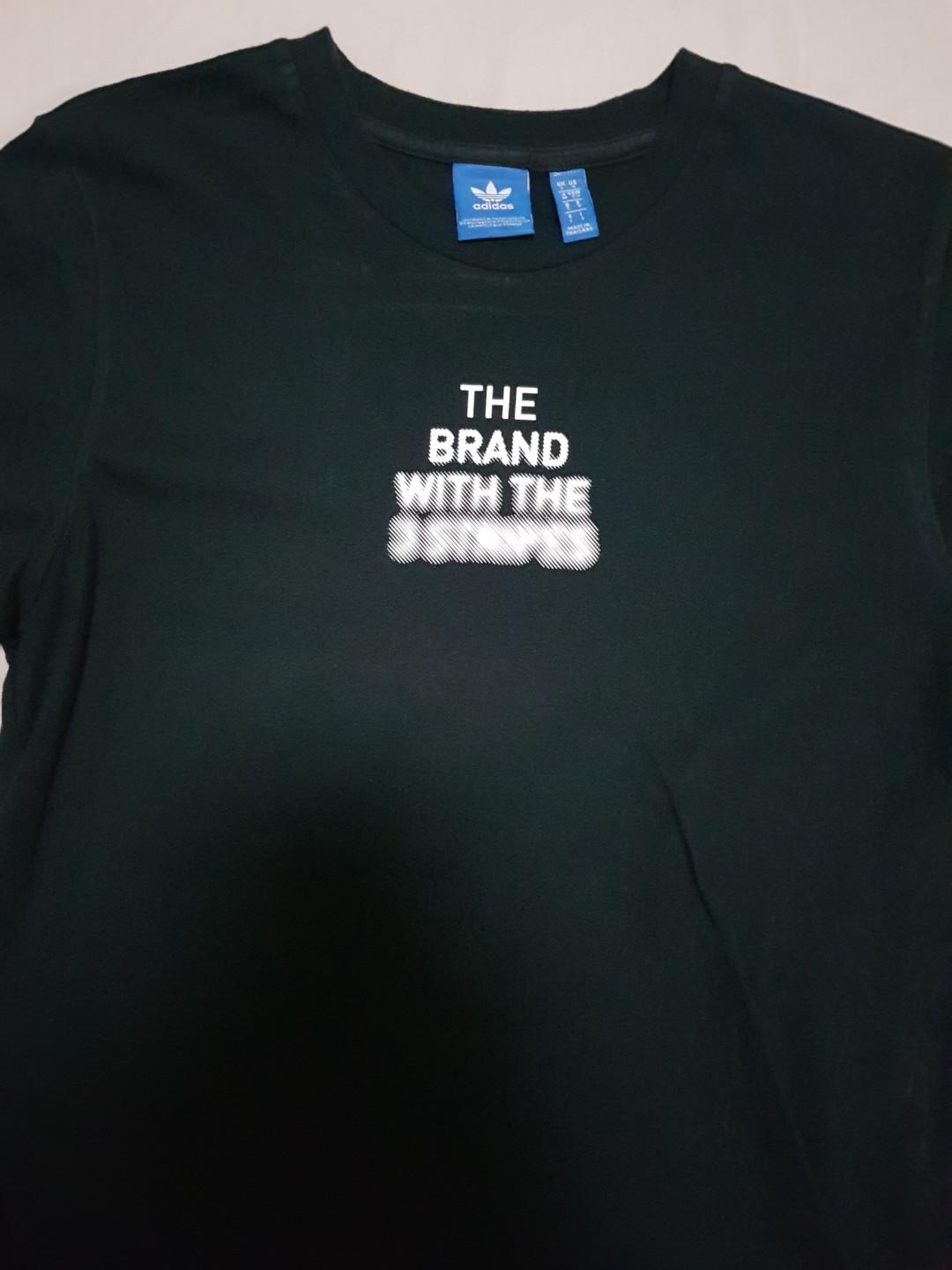 the brand with the 3 stripes shirt