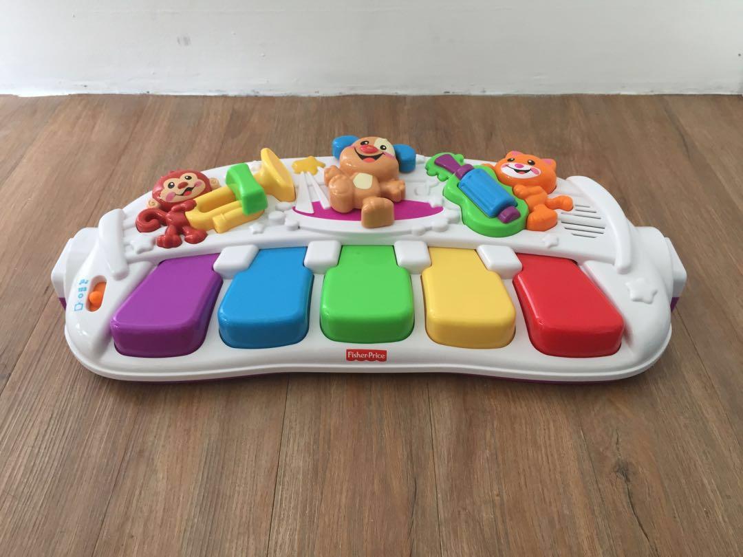 Fisher price learn sale and move music station
