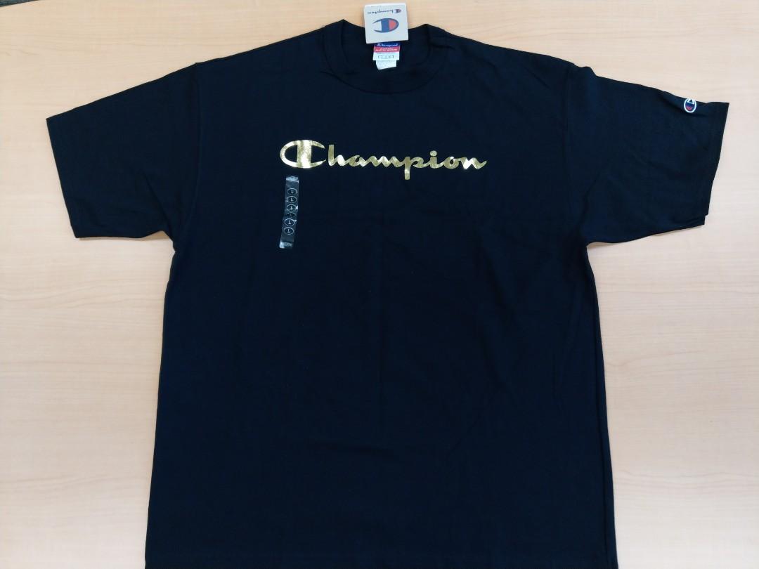 black champion shirt with gold writing