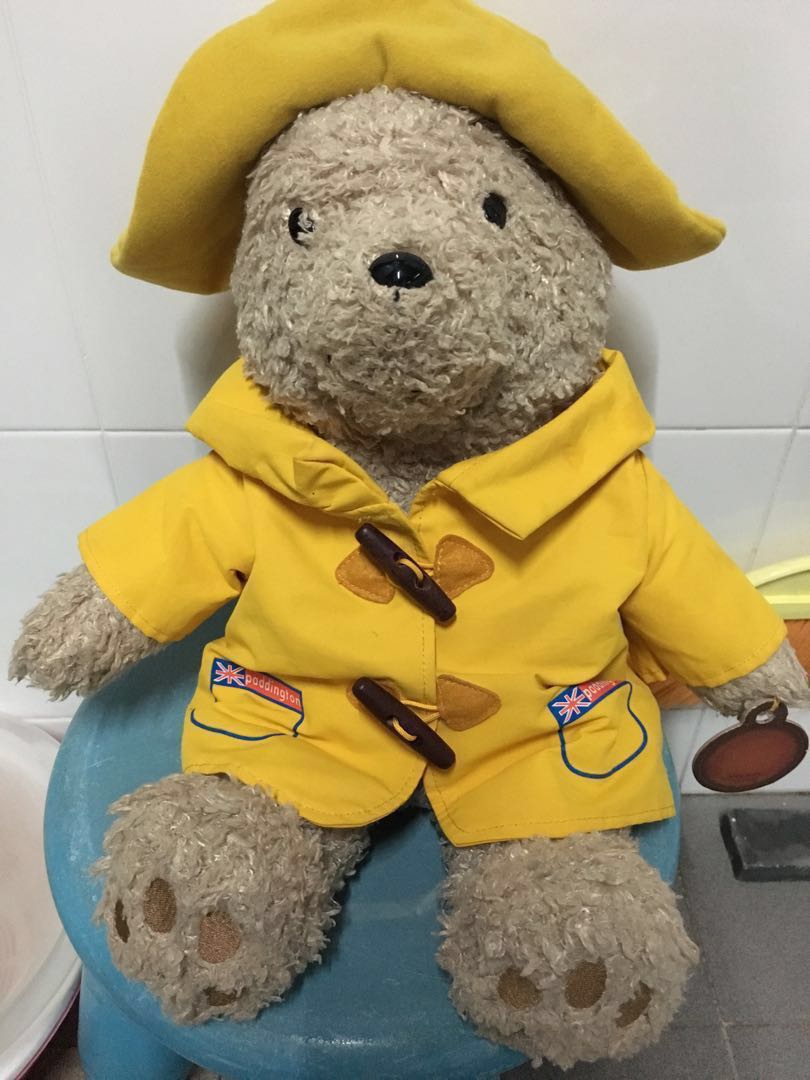 teddy bear with yellow raincoat