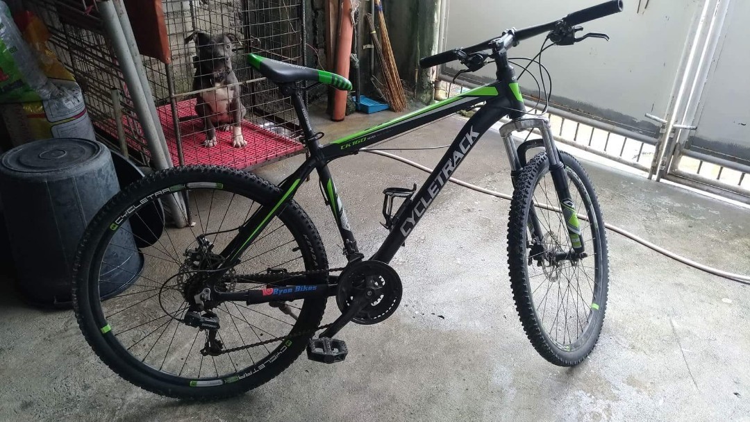 green and black mountain bike