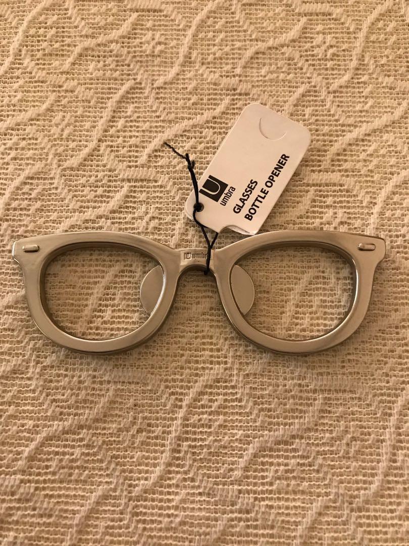 Umbra Glasses Bottle Opener (Category: Other Kitchenware & Tableware) located in Las Pinas. Submitted by mickey0901 (Listing ID 197066008, Image 1). Description: Bottle Opener in the shape of glasses. Dimensions: 4 by 1 1/4 by 1/4 inches. Constructed of zinc. Unused; still with the product tag. For your modern bar or kitchen😜 Please read FULLY the Mailing and Delivery section BEFORE making an offer. #winsephora Ideal gift for an optician or anyo