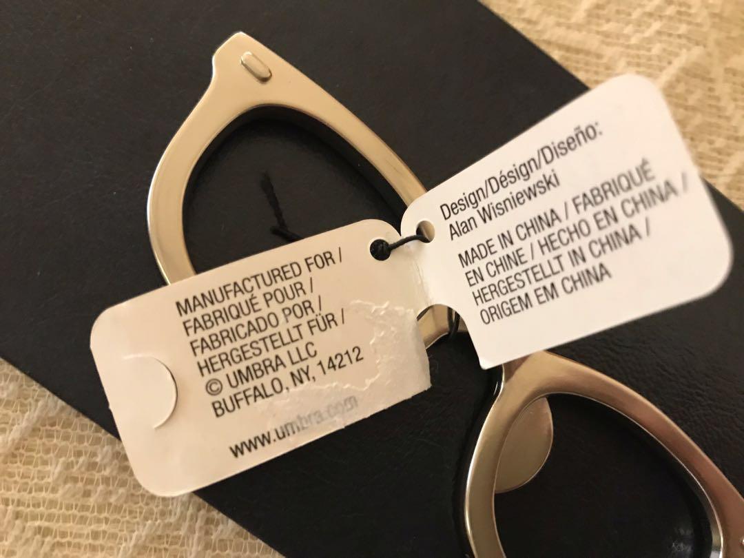 Umbra Glasses Bottle Opener (Category: Other Kitchenware & Tableware) located in Las Pinas. Submitted by mickey0901 (Listing ID 197066008, Image 3). Description: Bottle Opener in the shape of glasses. Dimensions: 4 by 1 1/4 by 1/4 inches. Constructed of zinc. Unused; still with the product tag. For your modern bar or kitchen😜 Please read FULLY the Mailing and Delivery section BEFORE making an offer. #winsephora Ideal gift for an optician or anyo