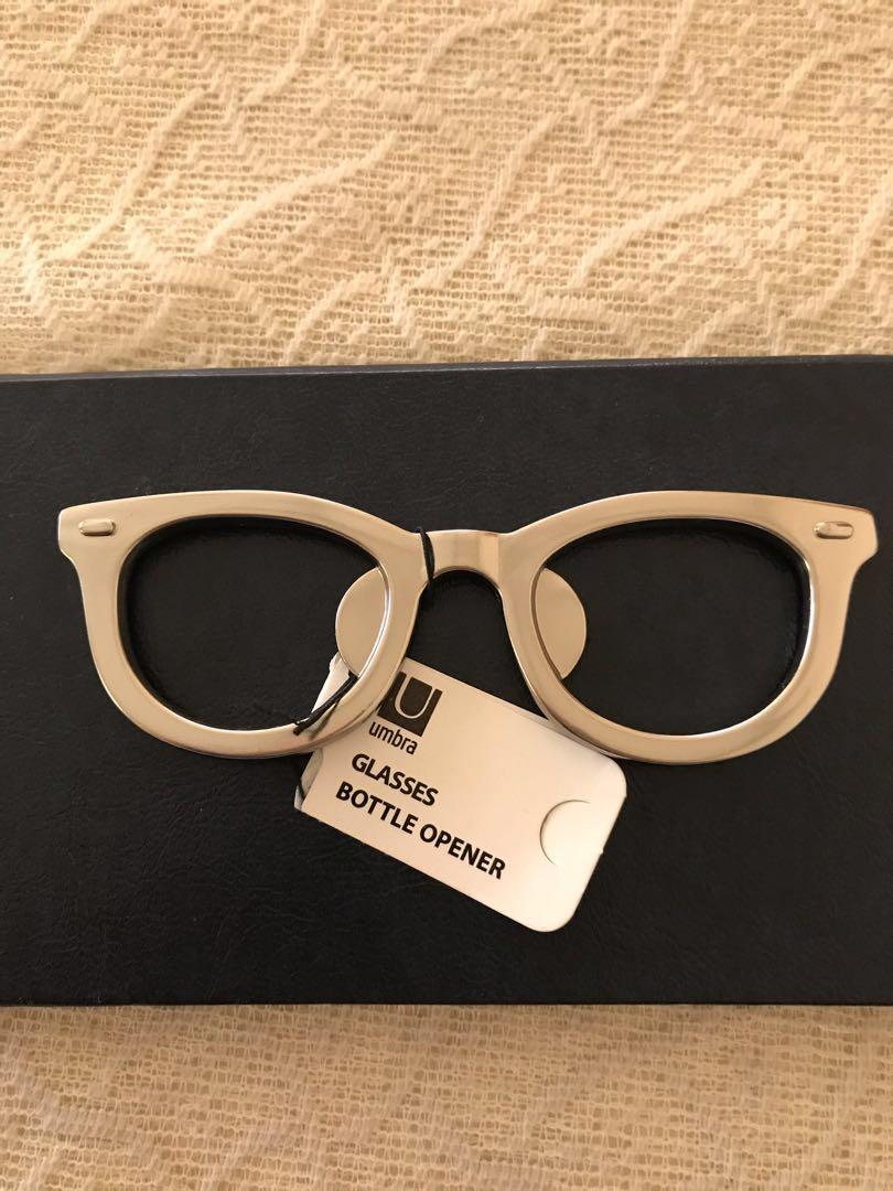 Umbra Glasses Bottle Opener (Category: Other Kitchenware & Tableware) located in Las Pinas. Submitted by mickey0901 (Listing ID 197066008, Image 2). Description: Bottle Opener in the shape of glasses. Dimensions: 4 by 1 1/4 by 1/4 inches. Constructed of zinc. Unused; still with the product tag. For your modern bar or kitchen😜 Please read FULLY the Mailing and Delivery section BEFORE making an offer. #winsephora Ideal gift for an optician or anyo