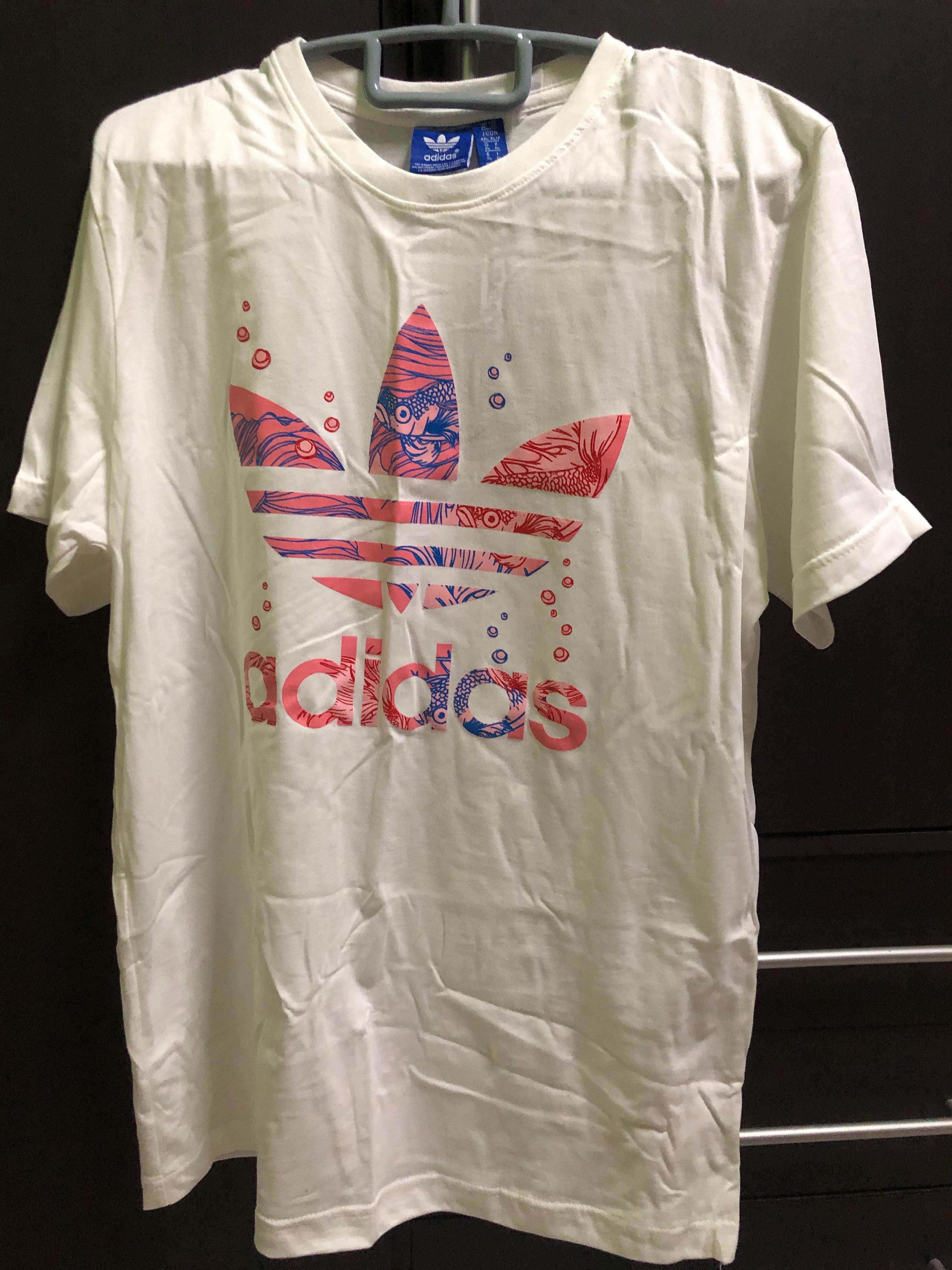 white adidas shirt with pink logo