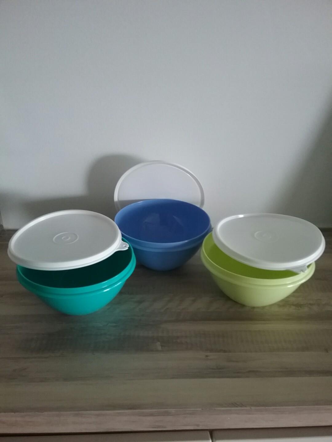 Tupperware container (Category: Everything Else) located in Singapore. Submitted by yeh2632 (Listing ID 198305790, Image 1). Description: V shape container. Diameter 14.5cm. High 8cm. 3 for $20.