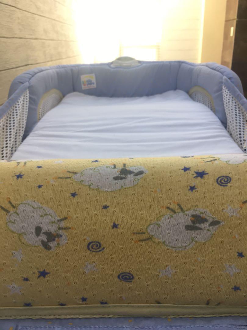 The first years close & secure portable infant sleeper 2025