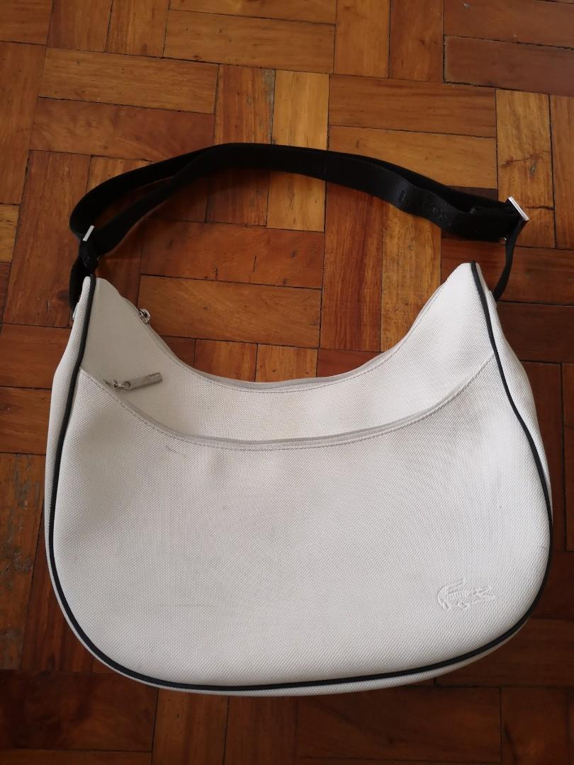 Lacoste Hobo/Sling Bag (Original) (Category: Cross-body Bags) located in Makati City. Submitted by cleverdolphin_034bed (Listing ID 198822562, Image 1). Description: Used but not abused, just need cleaning. Bought many years ago Rfs: decluttering.
