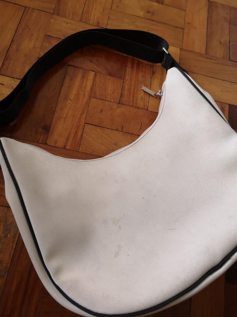 Lacoste Hobo/Sling Bag (Original) (Category: Cross-body Bags) located in Makati City. Submitted by cleverdolphin_034bed (Listing ID 198822562, Image 3). Description: Used but not abused, just need cleaning. Bought many years ago Rfs: decluttering.
