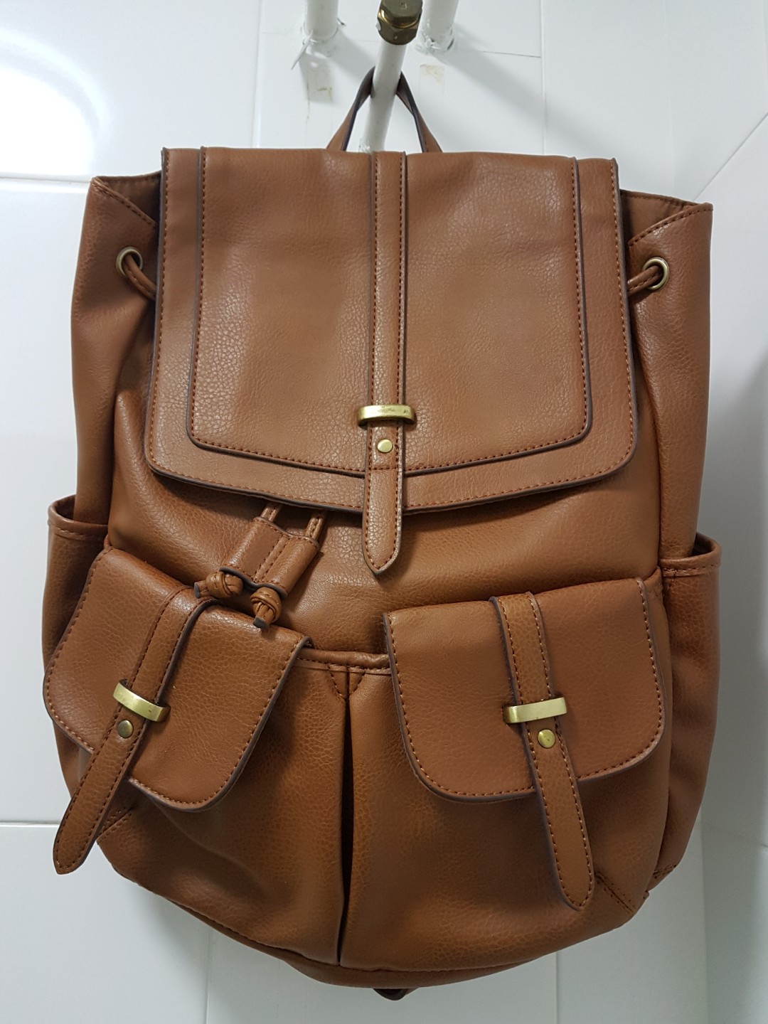 accessorize tan backpack