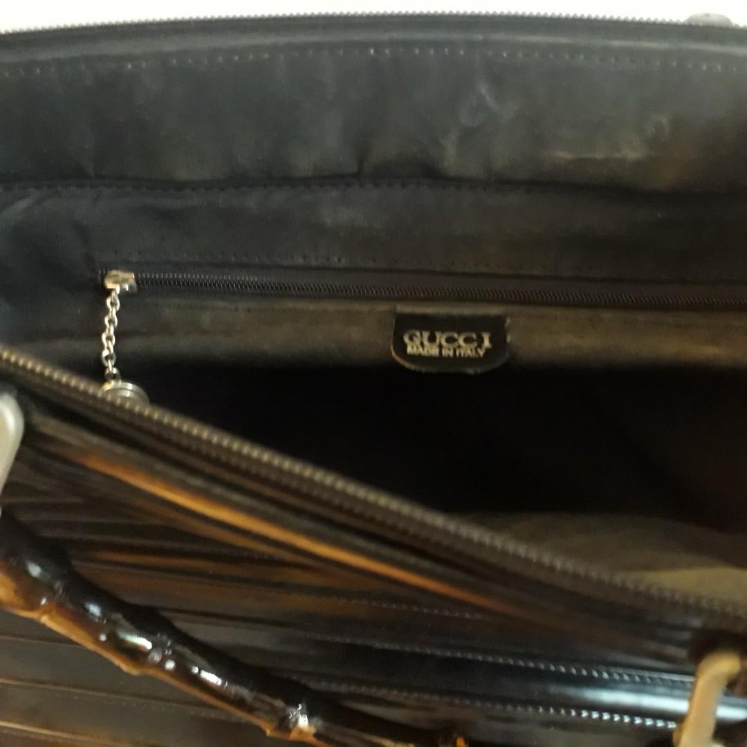 Unique document bag (Category: Tote Bags) located in Singapore. Submitted by debbiely2006 (Listing ID 199190164, Image 4). Description: Leather document bag in good condition with pin-tuck sewing and bamboo handles. Rare design..