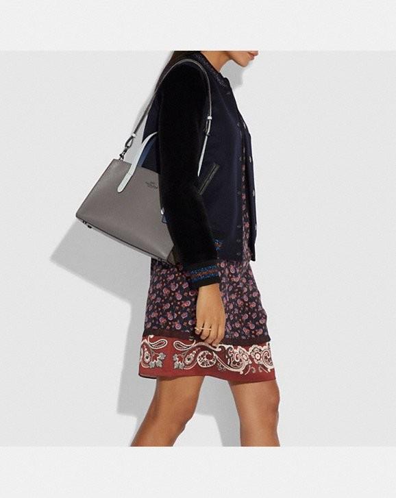 coach charlie carryall snakeskin