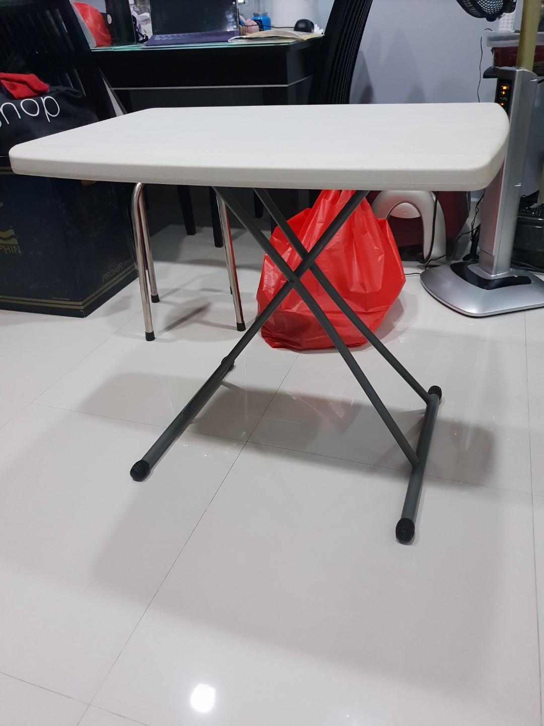 Foldable Table (Category: Tables & Sets) located in Singapore. Submitted by sparklegirl (Listing ID 199261122, Image 2). Description: Adjustable Height Portable Table. Easy to set up. Have 2 sets. Kept i storage and rarely use and letting go to make space in store room..