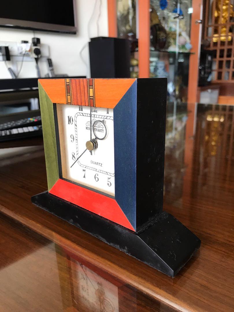 Table / deck clock (Category: Coffee & Tea Tableware) located in Singapore. Submitted by butama6 (Listing ID 199458391, Image 3). Description: Make fr Taiwan. Solid wood, not compress or ply wood Ve kept more than 15 yrs, working well Pic 3: L17 x H13 x W 4cm Pic 4 : W5 x H 12 x L 9cm.