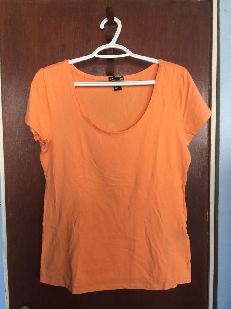 H&m Orange Basic Tee (Category: Others Tops) located in Cebu City. Submitted by crispylee (Listing ID 199830860, Image 1). Description: Used only a few times. Scoop neck. Stretchy material. Good condition. .