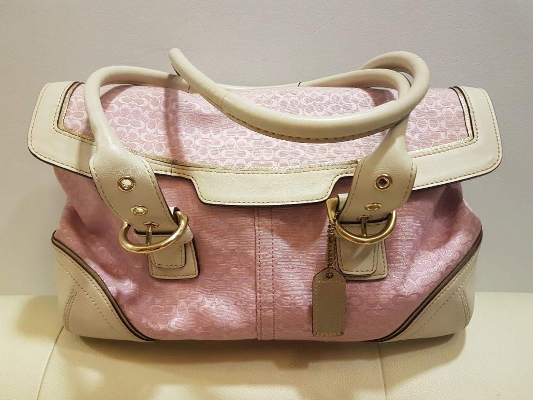 coach purse with pink trim