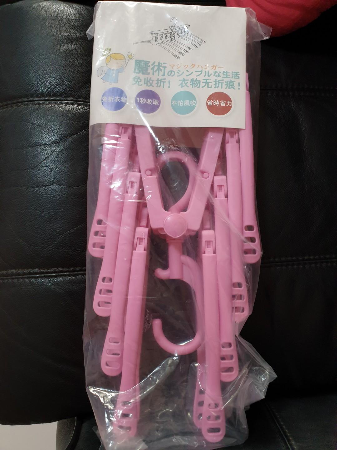 Multi-function magic hanger rack folding (Category: Home Improvement Tools & Accessories) located in Singapore. Submitted by jaslyn_chua (Listing ID 200096655, Image 1). Description: Multi-function magic hanger rack folding Pink colour Weight: 550g.