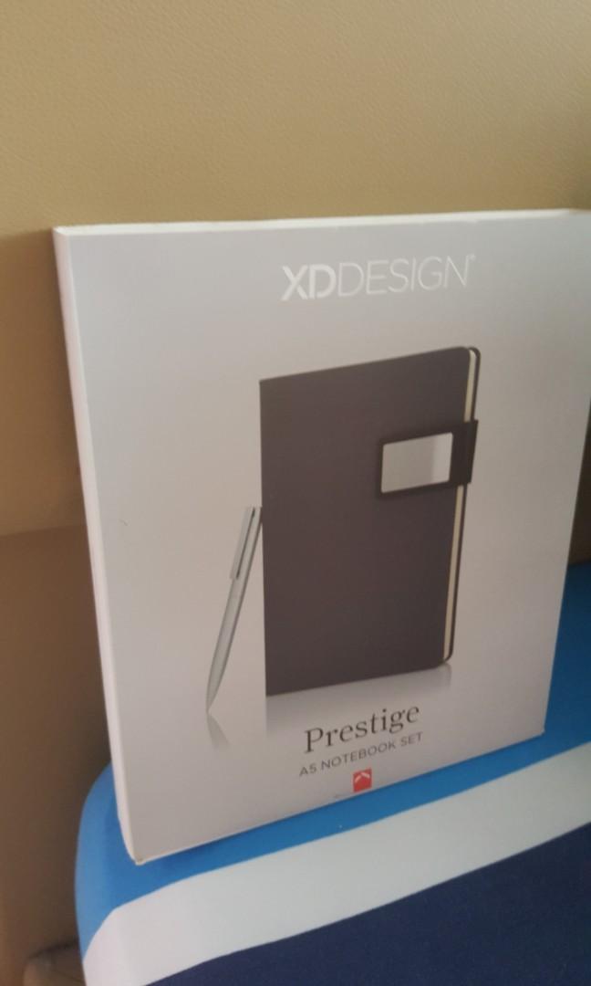 Notebook set (Category: Stationery & School Supplies) located in Singapore. Submitted by richardang (Listing ID 200624519, Image 1). Description: Prestige is anA5 notebook set with stylish fabric inside and outside, magnetic closure and metal plate. 96 sheets notebook and includes stainless steel pen. All new..