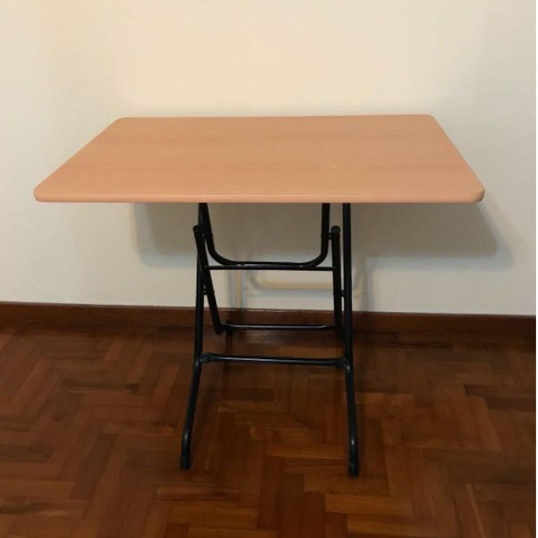 FOLDABLE STUDY/MULTIPURPOSE TABLE (Category: Tables & Sets) located in Singapore. Submitted by dreamwerks (Listing ID 200792041, Image 2). Description: SELLING IT URGENTLY! -CONDITION : 10/10 - Very convenient - Selling it because i bought it without realizing that there's one similar table in my store room! - USUAL PRICE : $60 -ABLE TO DELIVER TO YOUR LOCATION WITH DELIVER FEE OF $20-.