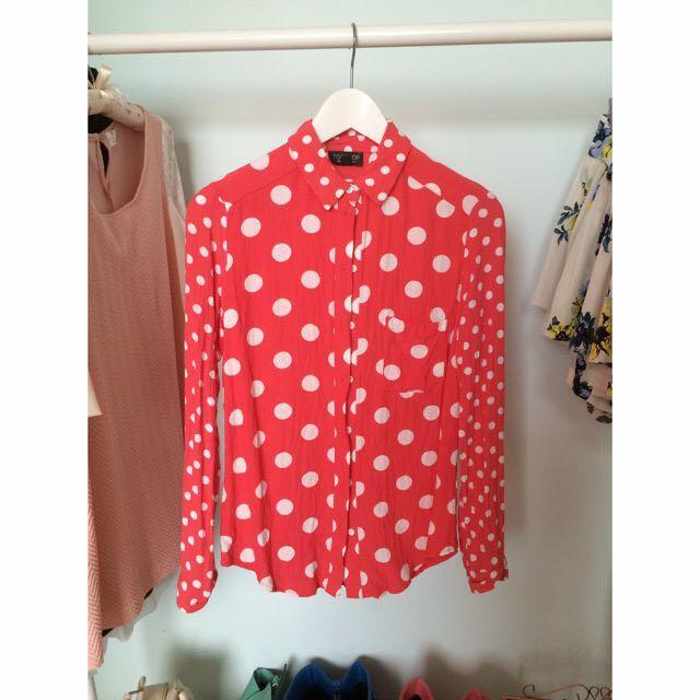 red blouse with white polka dots