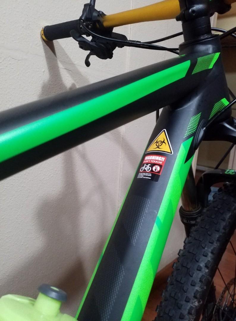 black and green scott mountain bike