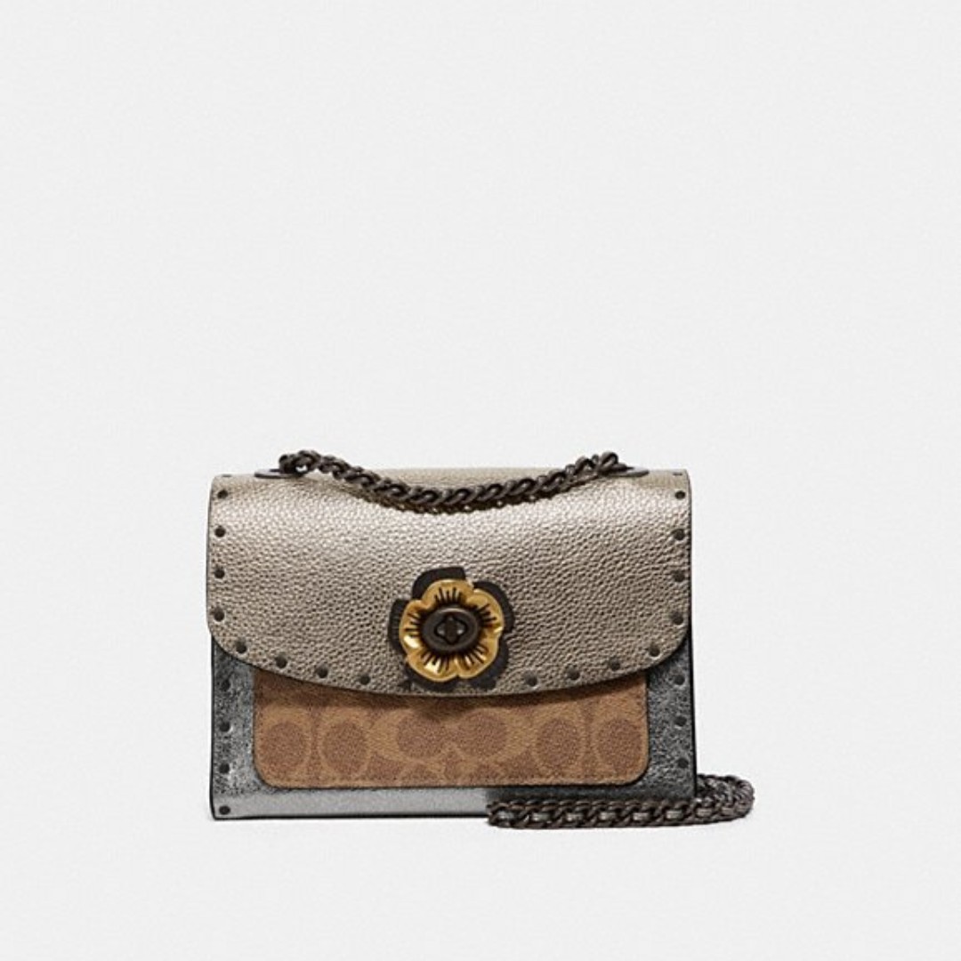 coach parker with rivets and snakeskin detail