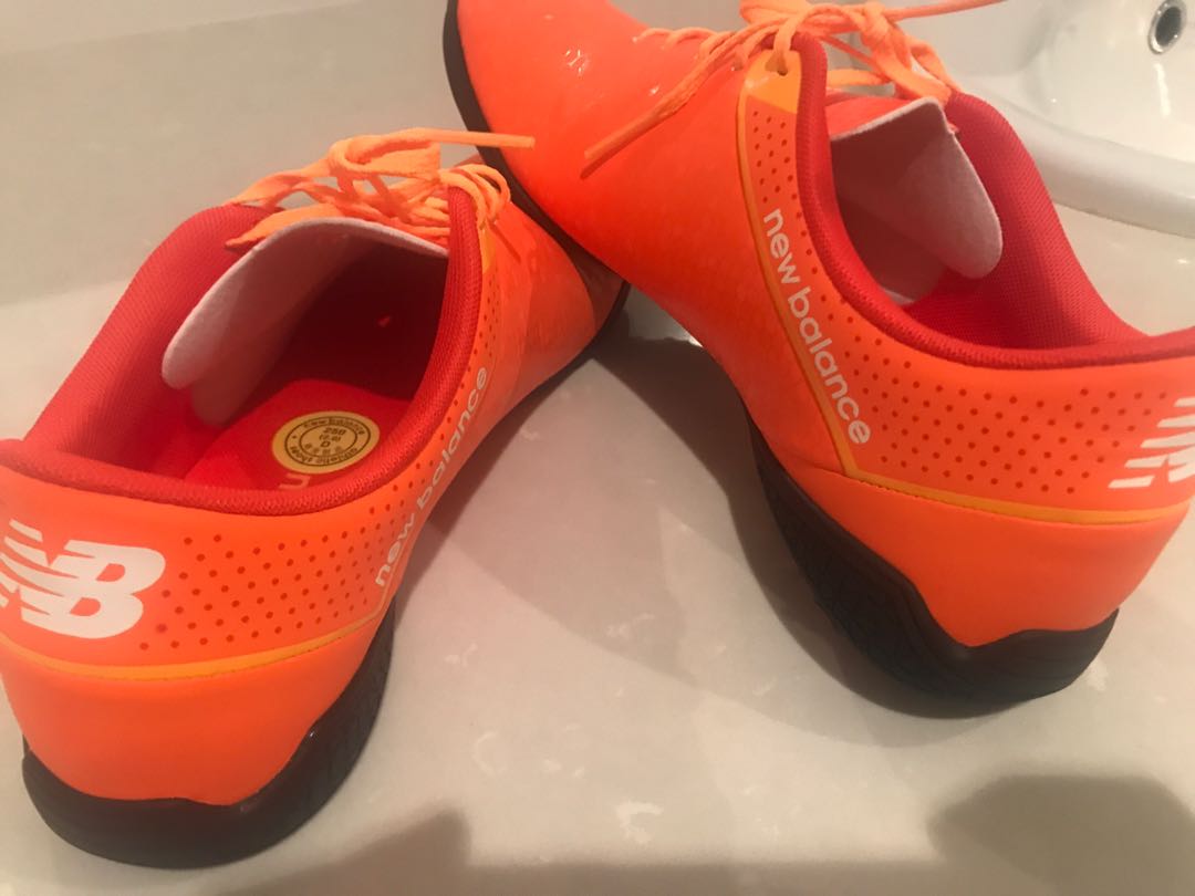 new balance orange turf shoes