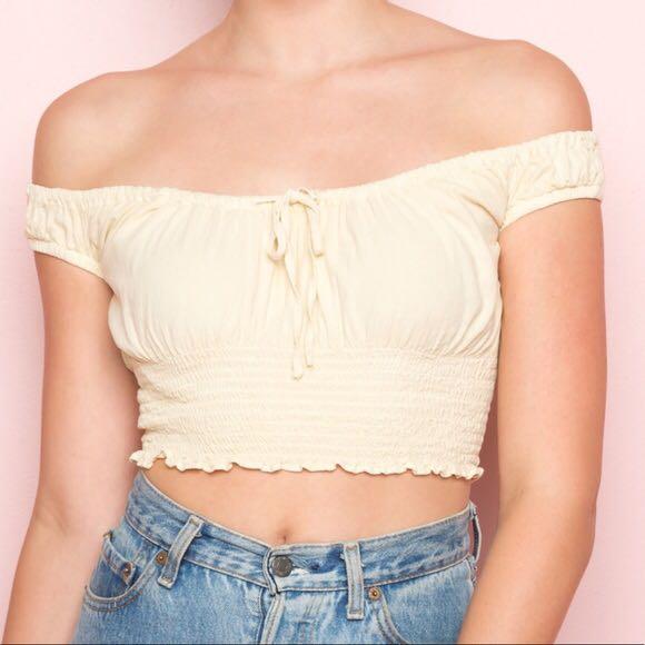 brandy melville off the shoulder top in a yellow