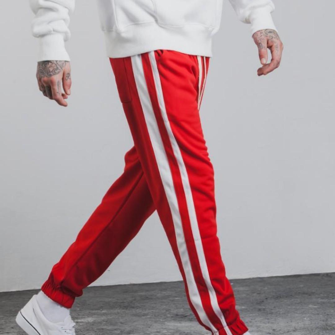 Red track pants white stripe top