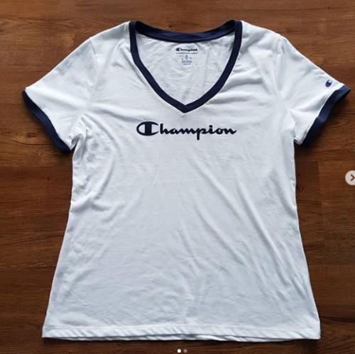 white and orange champion shirt