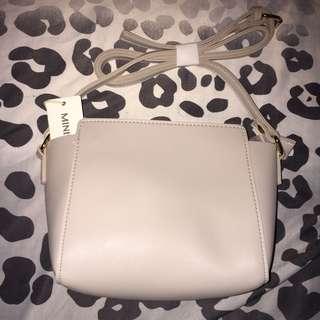 beige miniso sling bang