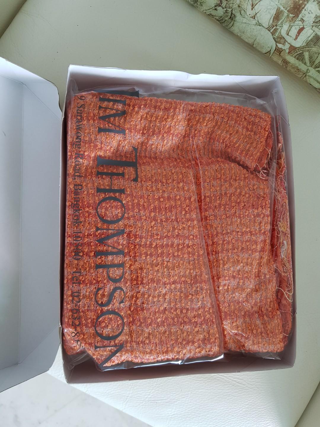 JIM THOMPSON Scarf (Category: Scarves) located in Singapore. Submitted by lolorotceig (Listing ID 202259356, Image 1). Description: Handwoven Silk Linen Scarf Color: Orange/Multi 80% Silk 20% Linen Still in its original package. NEVER worn Currently sold at 132 SGD retail price.