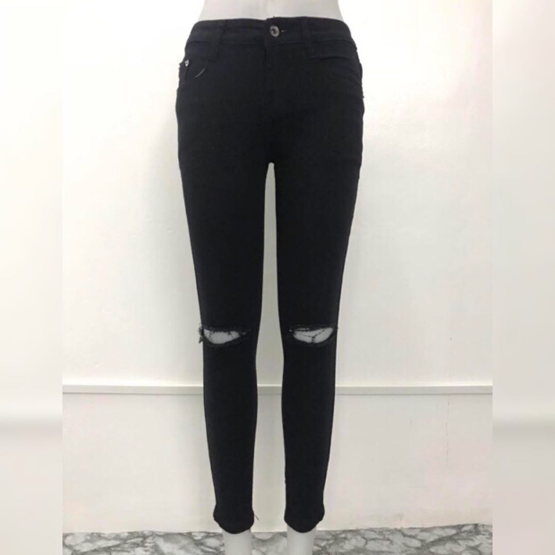 low rise black ripped jeans