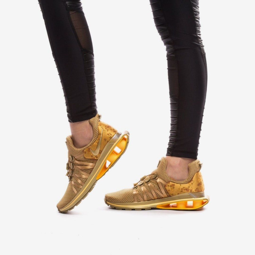 Nike shox gravity metallic gold women's shoe sale