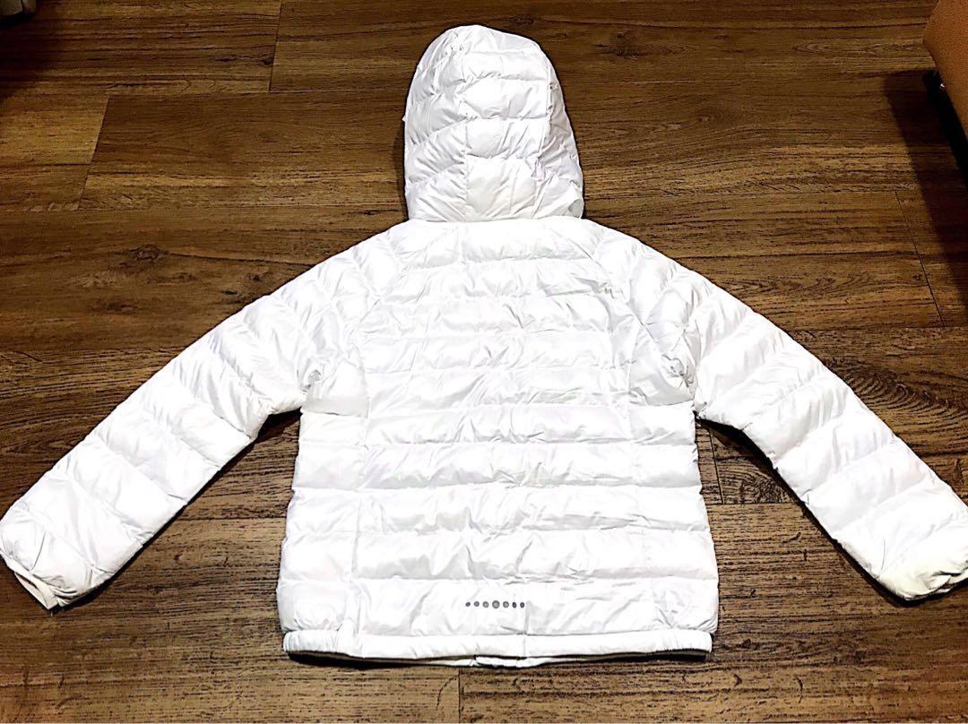 Uniqlo Winter Jacket (Category: Babies & Kids Fashion) located in Singapore. Submitted by iluvmtml (Listing ID 202497869, Image 2). Description: Condition: Used, slight yellowish @ some corners of the sleeve & areas, not very obvious when wearing it. Usage: Worn in 2 trips Material: polyester Letting go due to outgrown..