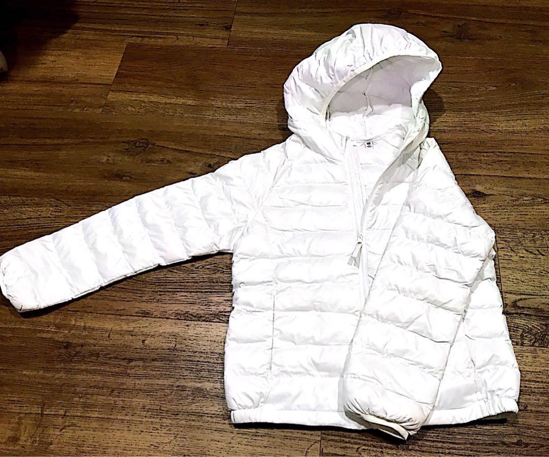 Uniqlo Winter Jacket (Category: Babies & Kids Fashion) located in Singapore. Submitted by iluvmtml (Listing ID 202497869, Image 4). Description: Condition: Used, slight yellowish @ some corners of the sleeve & areas, not very obvious when wearing it. Usage: Worn in 2 trips Material: polyester Letting go due to outgrown..