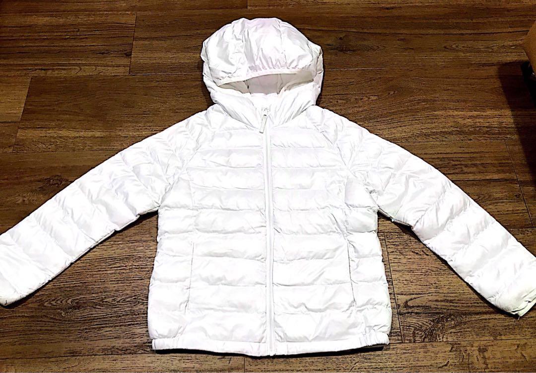 Uniqlo Winter Jacket (Category: Babies & Kids Fashion) located in Singapore. Submitted by iluvmtml (Listing ID 202497869, Image 1). Description: Condition: Used, slight yellowish @ some corners of the sleeve & areas, not very obvious when wearing it. Usage: Worn in 2 trips Material: polyester Letting go due to outgrown..