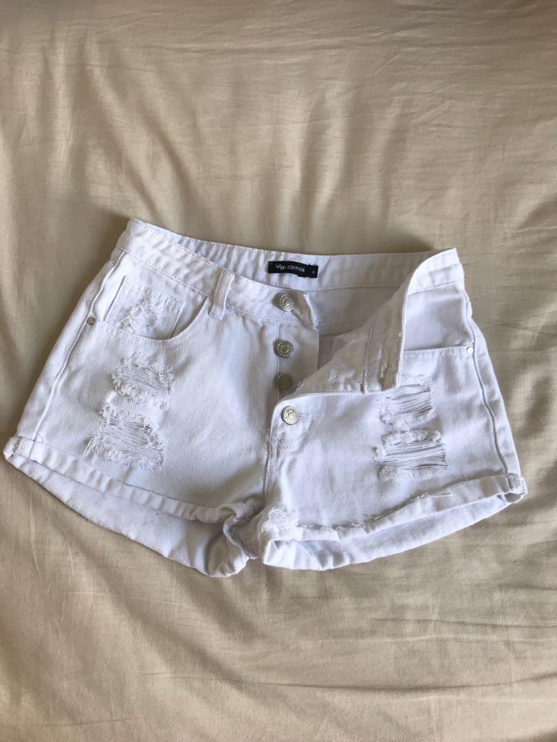 white ripped shorts