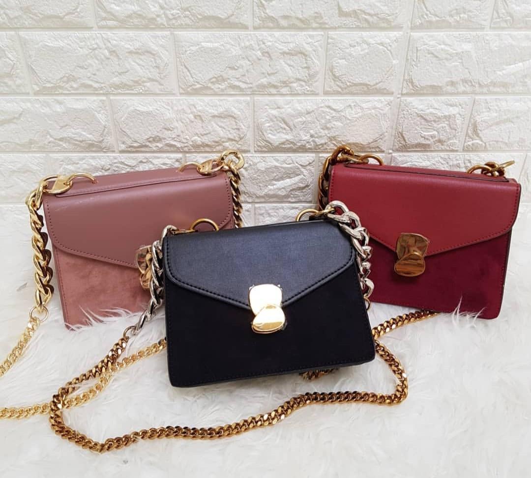 Metal detail front outlet flap bag