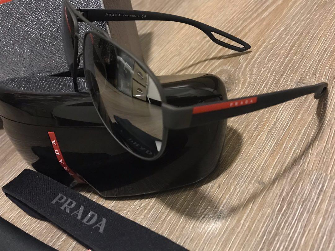 Authentic Prada Sunglasses (Category: Accessories) located in Kuala Lumpur. Submitted by s.mcmuffin (Listing ID 200034412, Image 3). Description: Good condition (for unisex) Matte design Free Sports Prada band that can be attached to sunglass No nego No fussy buyer Exclude postage.