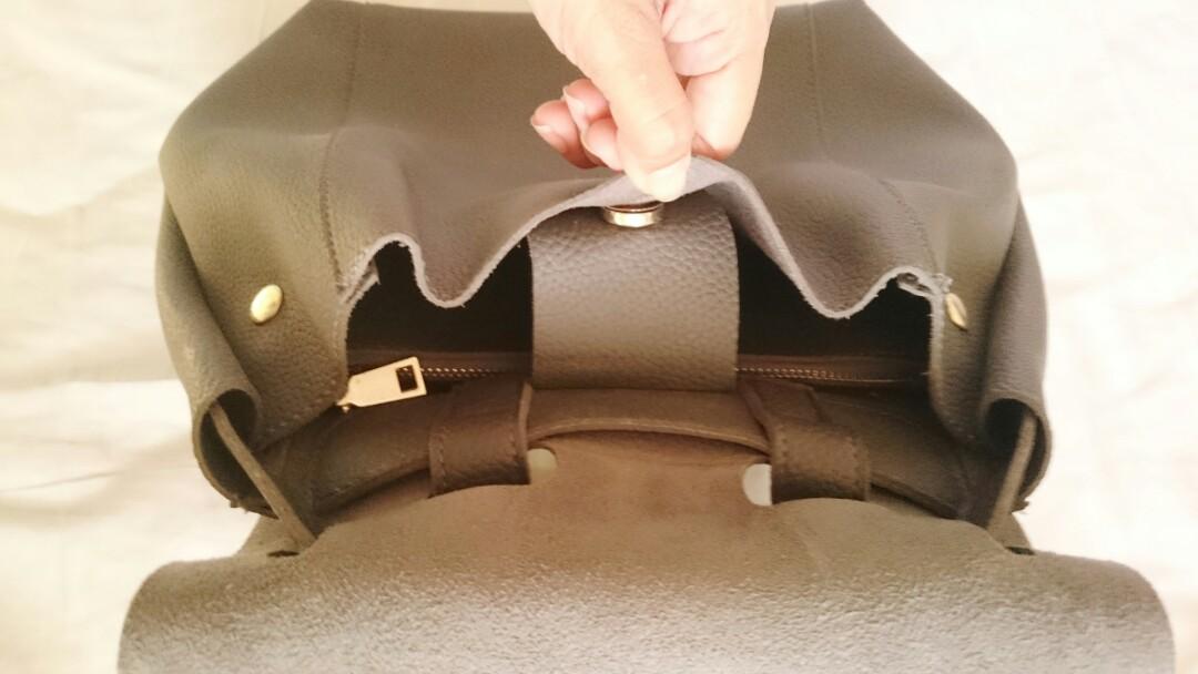 Gray Backpack (Category: Backpacks) located in Quezon City. Submitted by mallows23 (Listing ID 203620245, Image 3). Description: Gray backpack with magnetic clasp With detachable zippered pouch Used a few times Rfs: Too many bags.