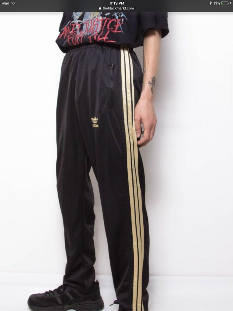 adidas pants with gold stripes