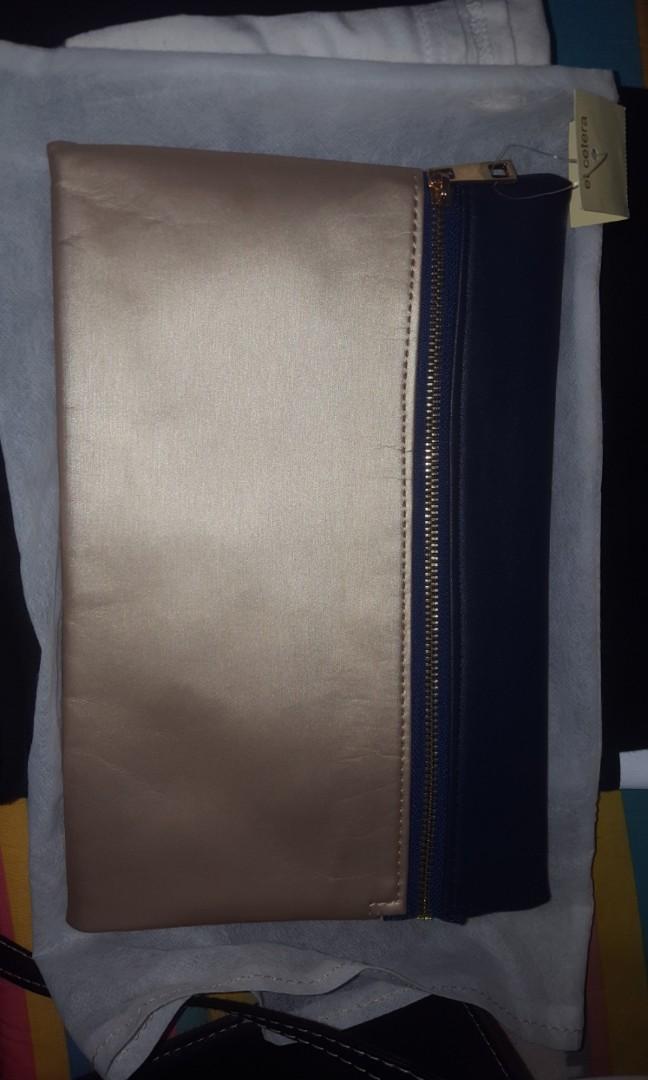 navy blue and gold clutch