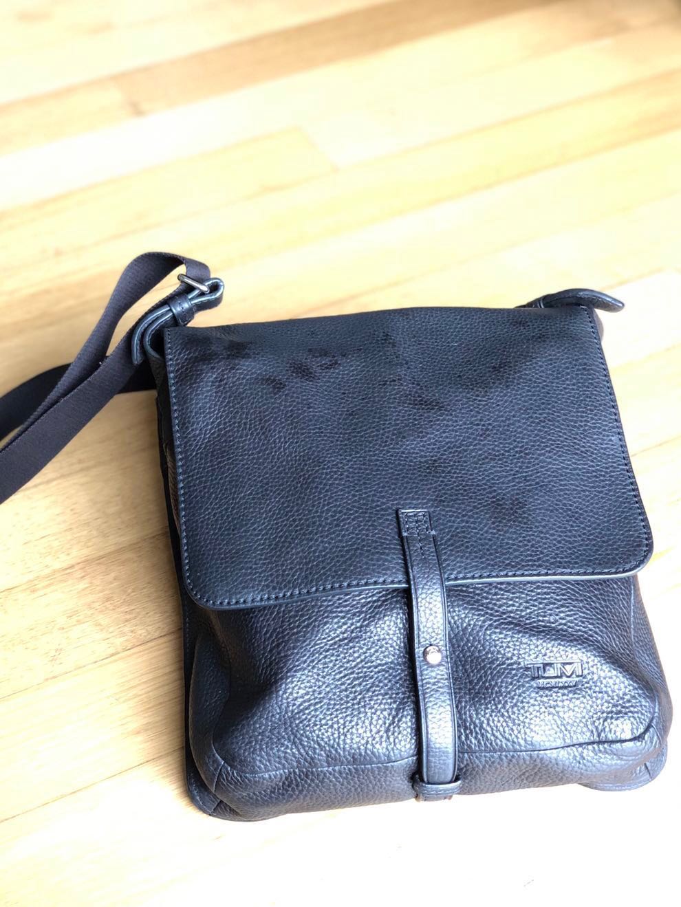 tumi leather messenger bag