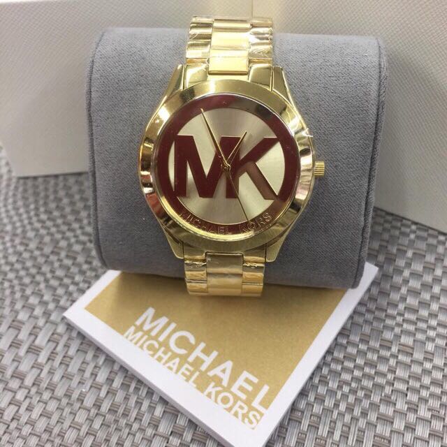 mk big face gold watch